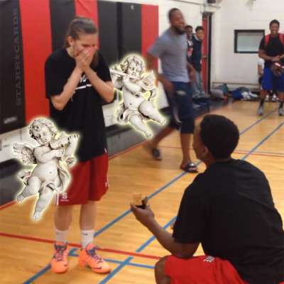 Alex Johnson proposes to Brey Dorsett during basketball game