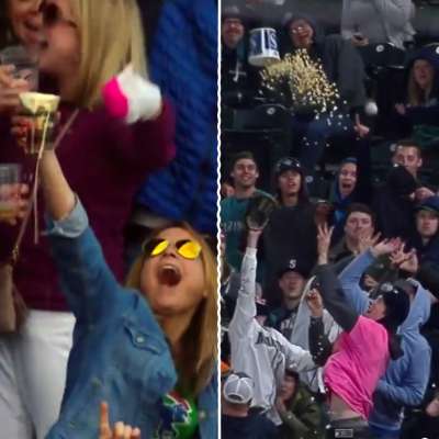 Cubs fan catches foul ball in beer, Mariners fan throws popcorn bucket